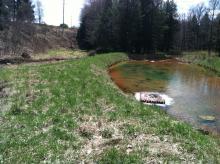 87 2 intake manifold in settling pond facing south april 2013